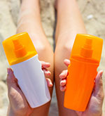 woman-holding-sunscreen-cover